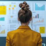 Rank and coordinator concept. Businesswoman analyzing data on a wall display.